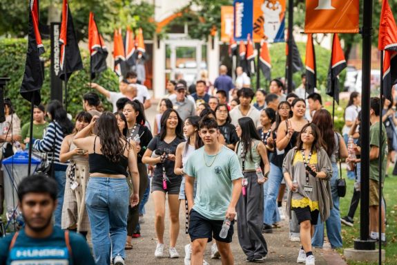 students walking on knoles lawn