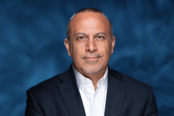 Portrait of a man in front of a blue background 