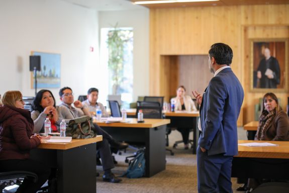An intrigued audience captivated by the speaker.