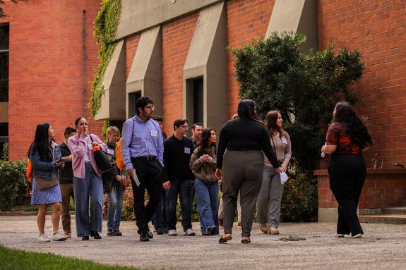 Group of people getting a tour of a campus.