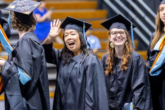 Benerd graduates in line at AG Spanos Center waiving