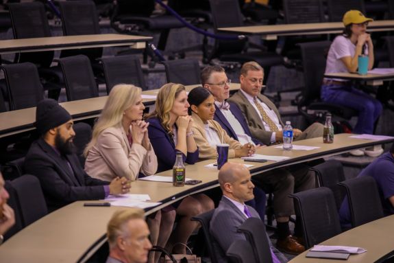 Students participating in a presentation by employers.