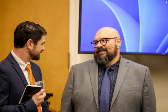 2 speakers discussing.