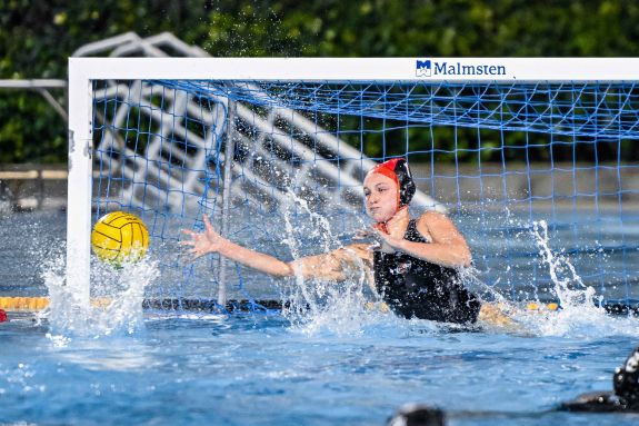 Sophomore goalkeeper Lillian Ecklund stretches to block a shot attempt.