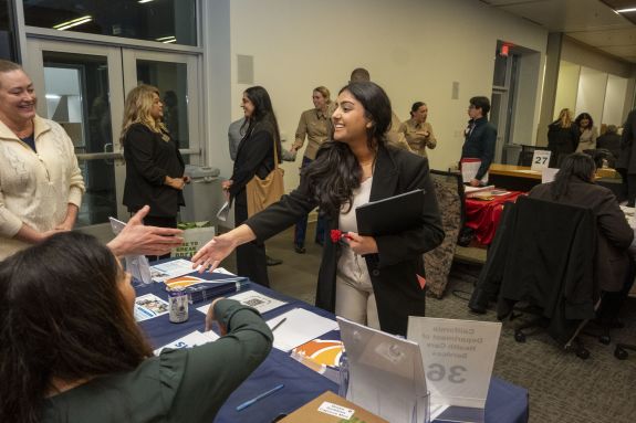 Student introducing herself to employers.