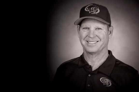a black and white photo of Coach Reed Peters
