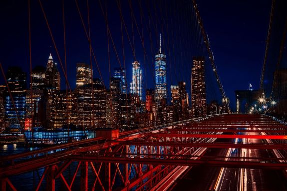 A nighttime photo of New York's iconic skyline. 
