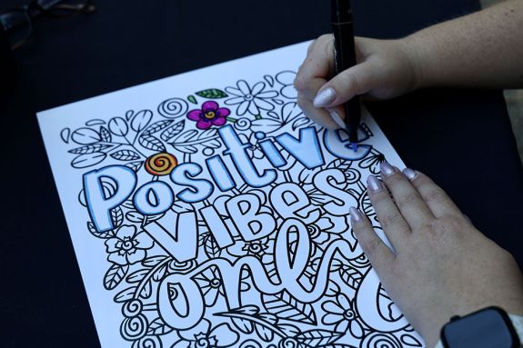A person coloring. 