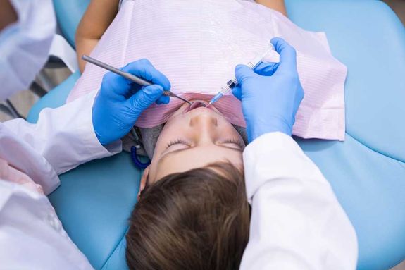 child having dental treatment