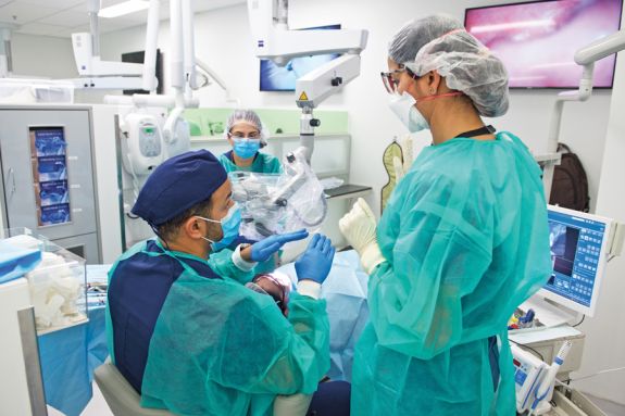 gowned people in clinic