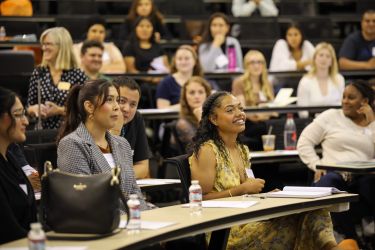 Students listen in on an info session