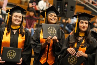 Students in the School of Health Sciences celebrate their graduation.