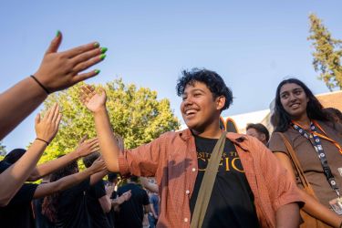 students high fiving