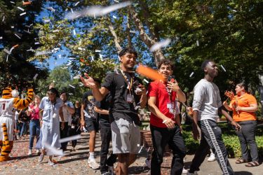 Students walking through confetti