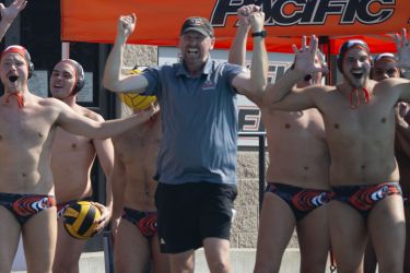 Head coach James Graham and the Tigers celebrate after a goal.