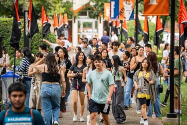 students walking on knoles lawn