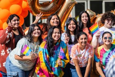 students posing during a pride event