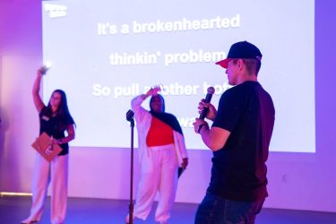 student signing karaoke