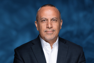 Portrait of a man in front of a blue background 