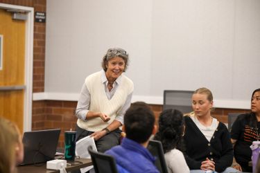 Speaker engaging with students.