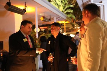 Dean Colatrella talks with alumni at the Mixer in 2025