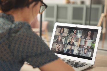 Young woman using computer for video call stock photo