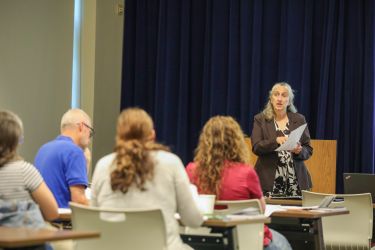 Passionate speaker informing an audience.