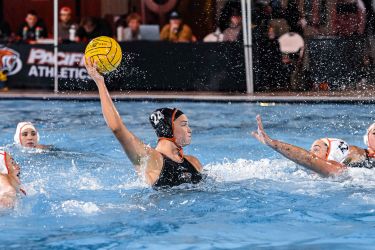 Freshman center Sophie Pethers controls the ball around defenders.