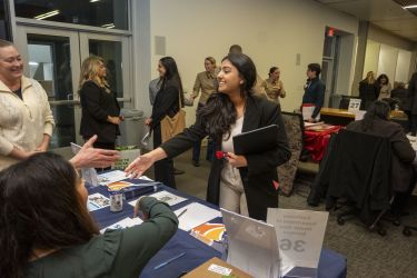 Student introducing herself to employers.