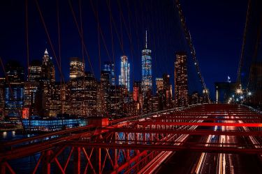 A nighttime photo of New York's iconic skyline. 