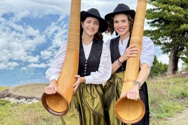 Professor Sadie Glass and student Ciera with alphorns