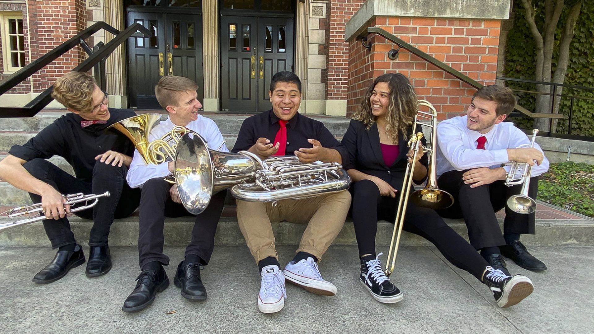 students sitting with instruments