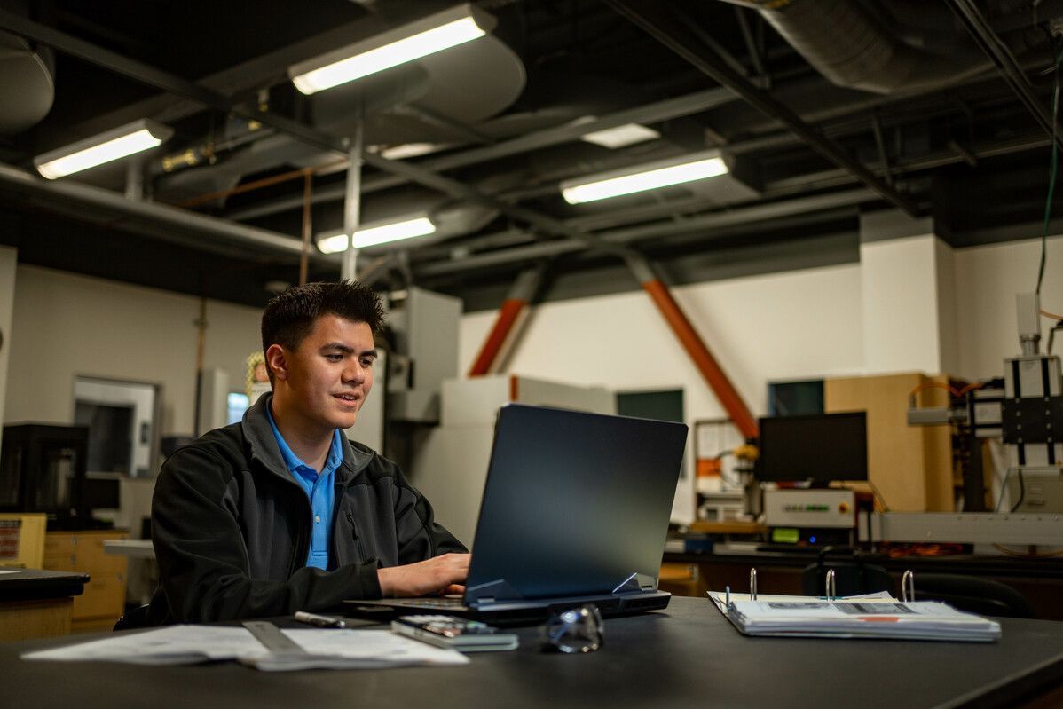 an engineering student works in a lab
