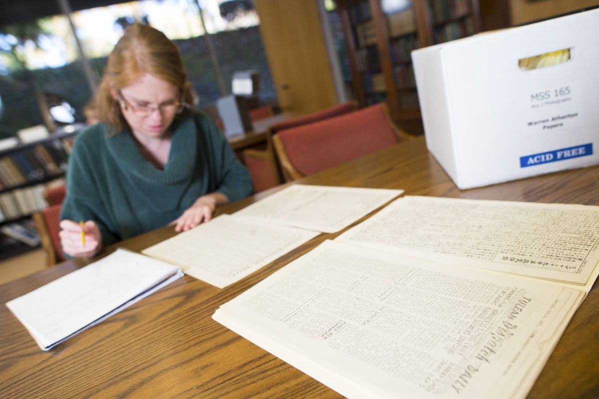 Archives spread out on a table in Special Collections