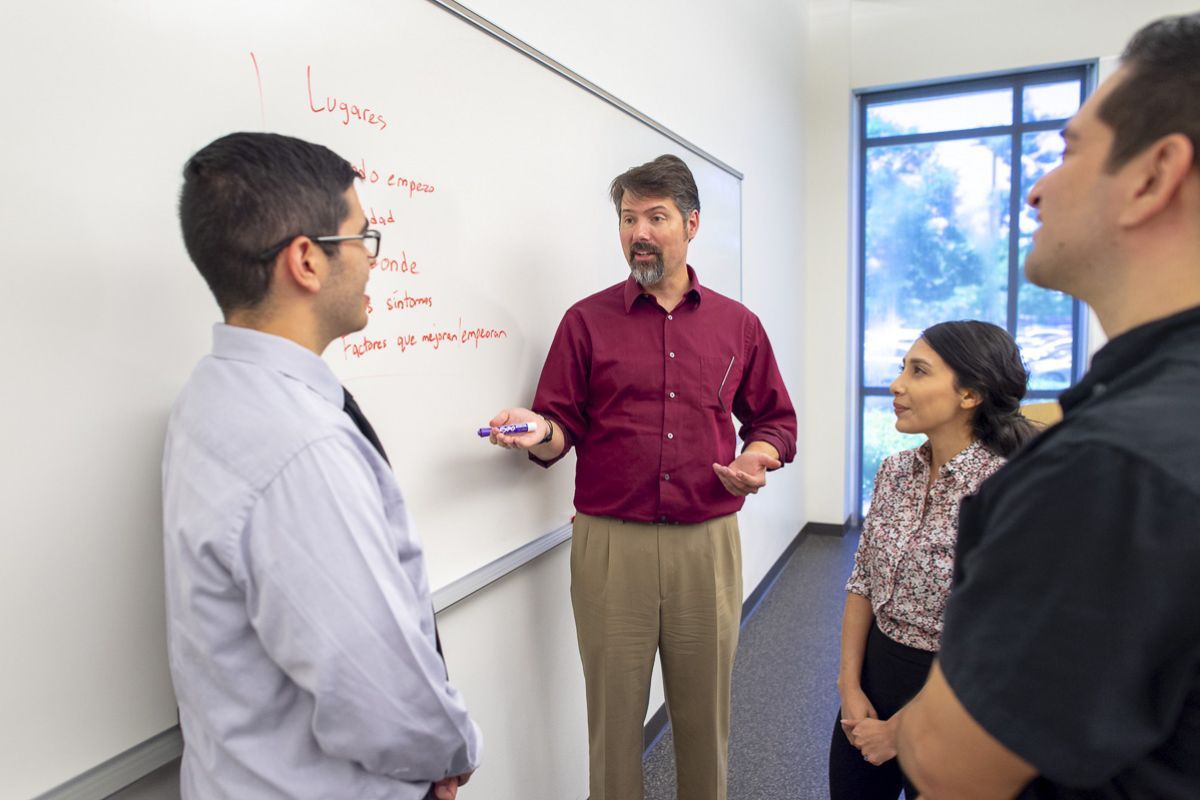 students in classroom with professor