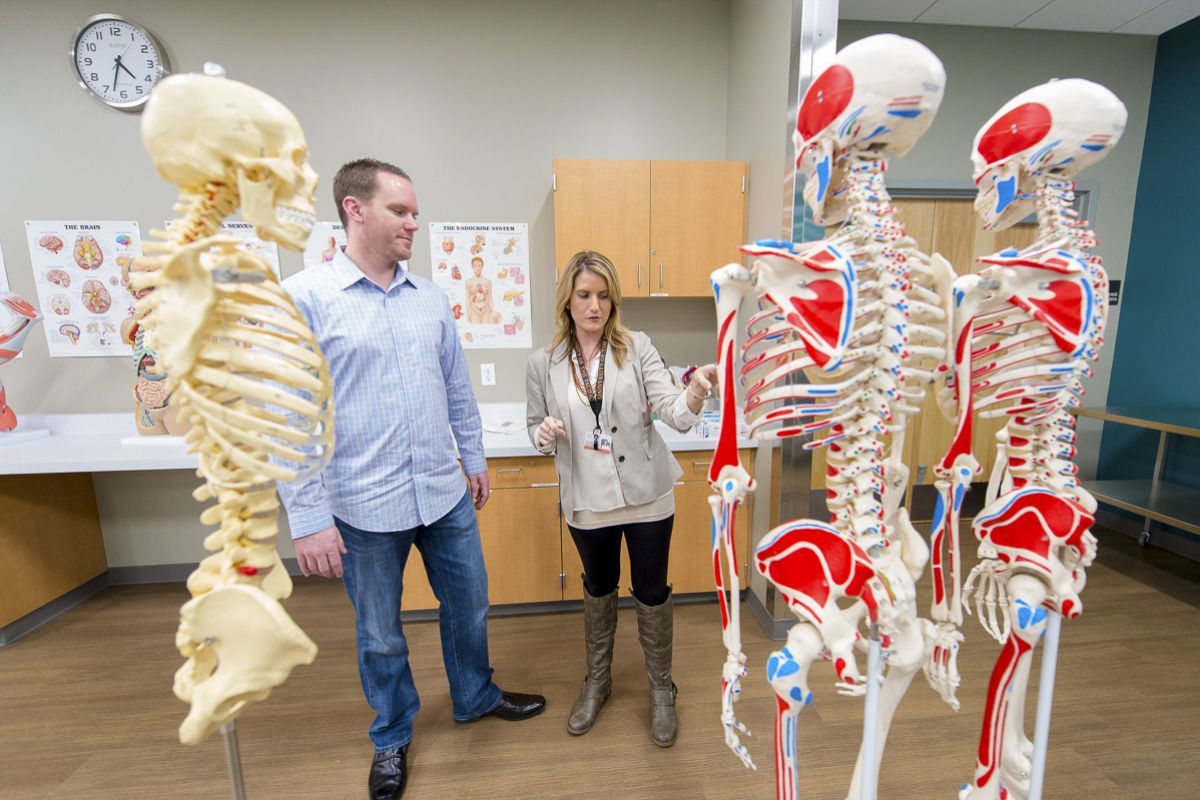students with skeletons in lab