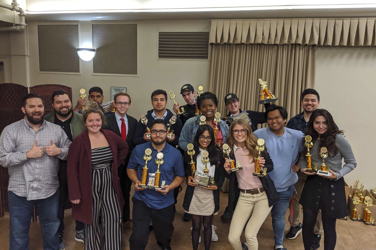 Debate team holding awards