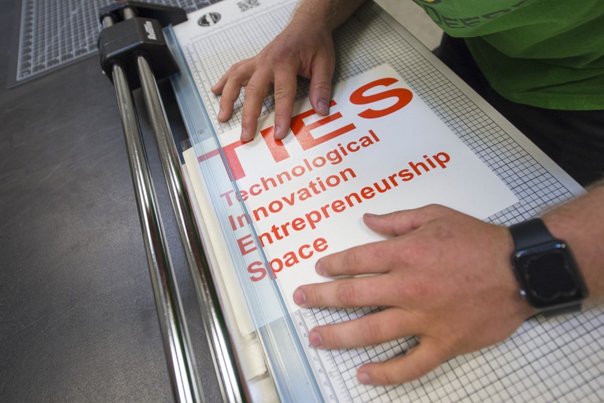 TIES sign being made.