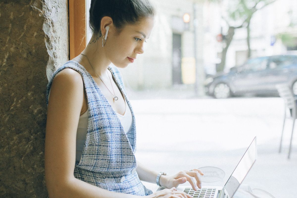 woman using laptop outdoors
