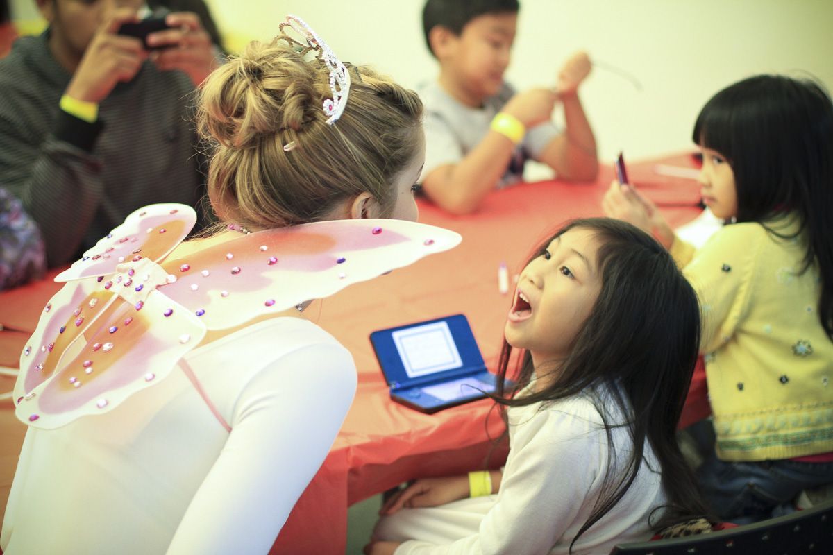 a student working with a young patient