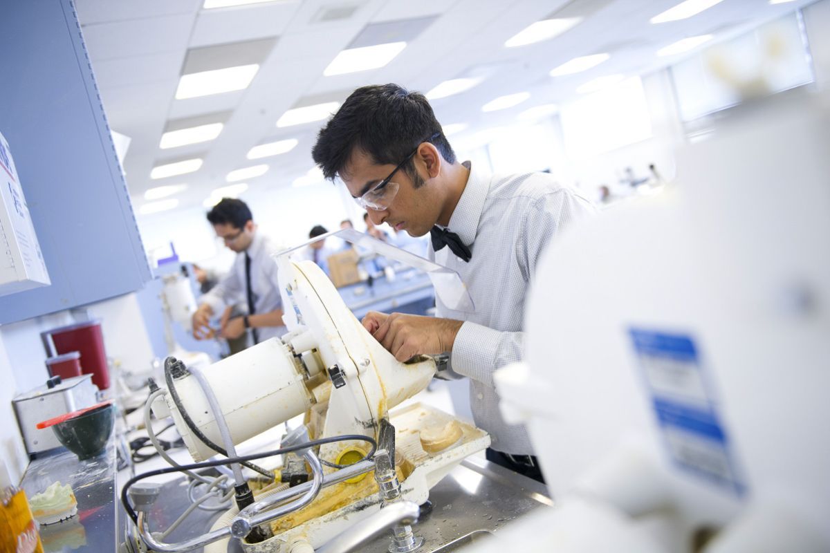 a student working in a dental clinic