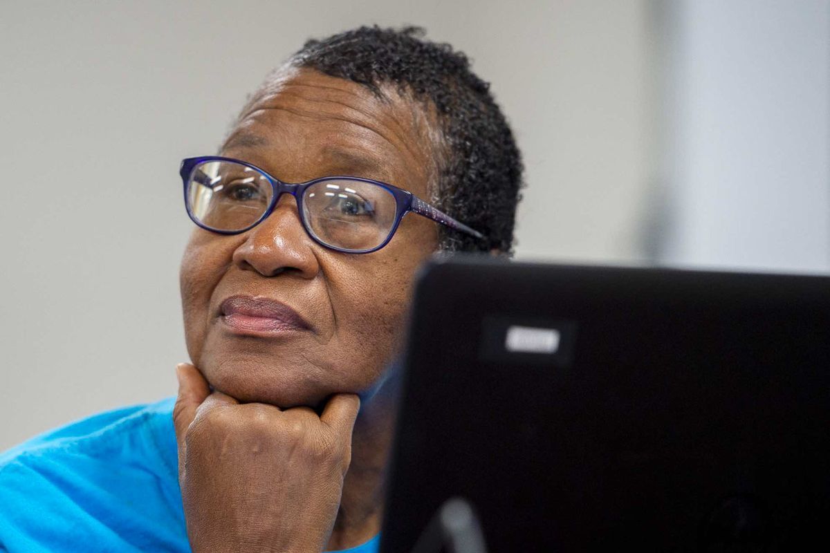 a woman paying attention, a laptop