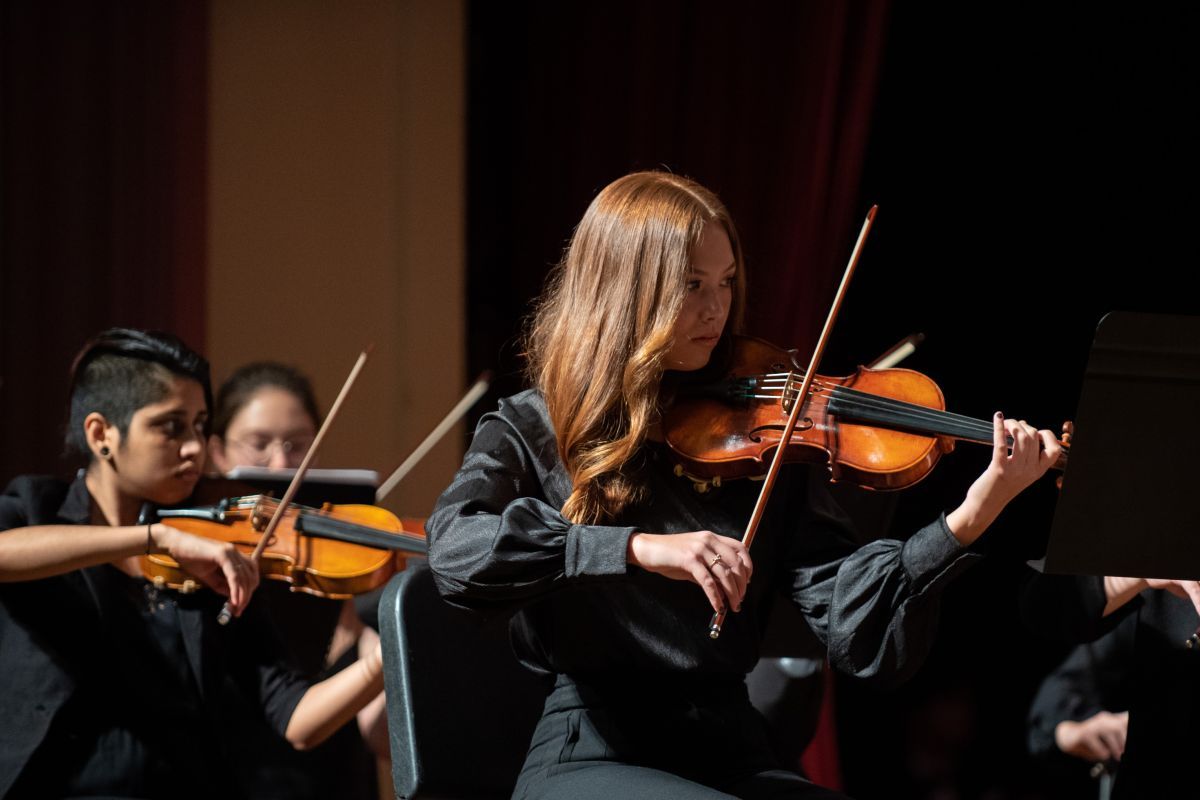a woman plays the violin