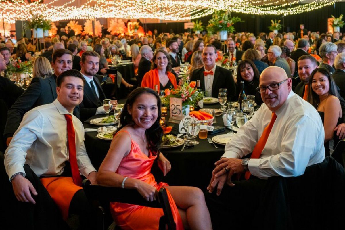 a room full of well-decorated tables and well-dressed people