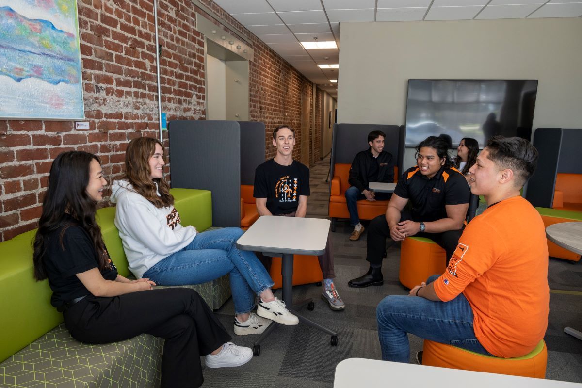 OT students talk together in a lounge area
