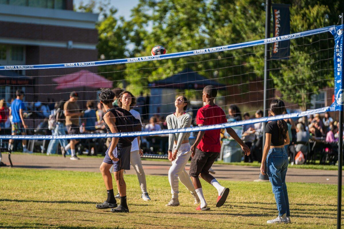 students playing volleyball casually