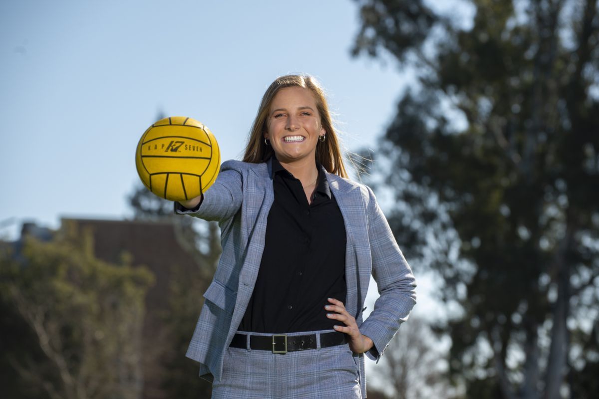 Female student holding water polo ball