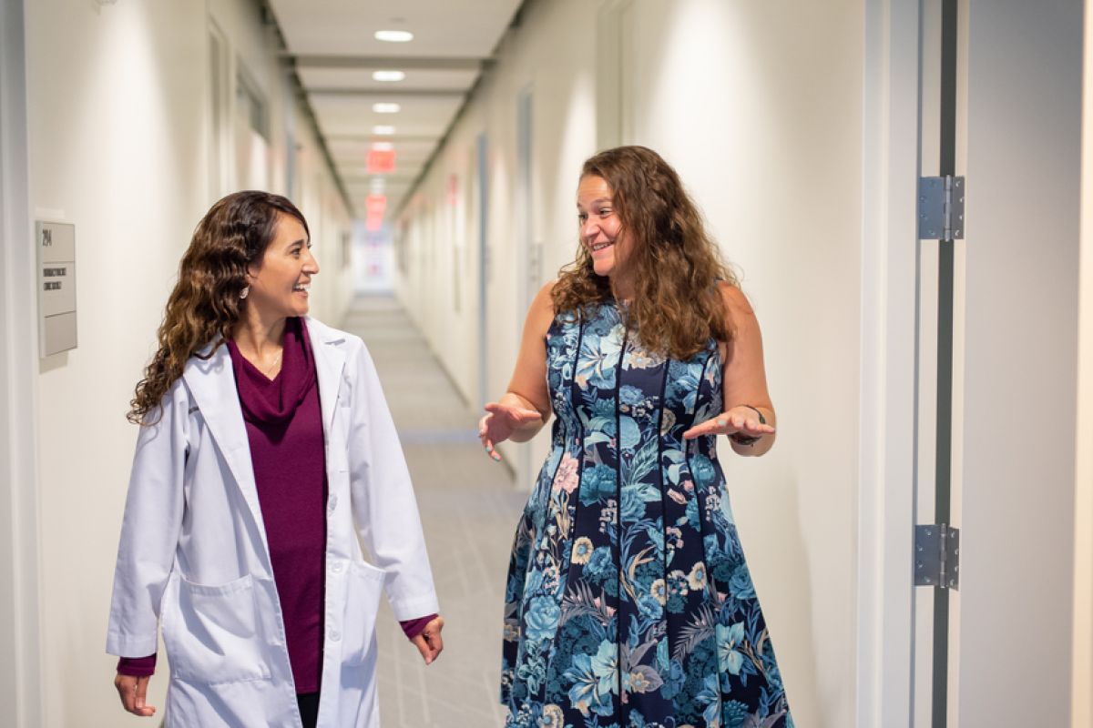 Health Science students discuss course concepts in the hallway 
