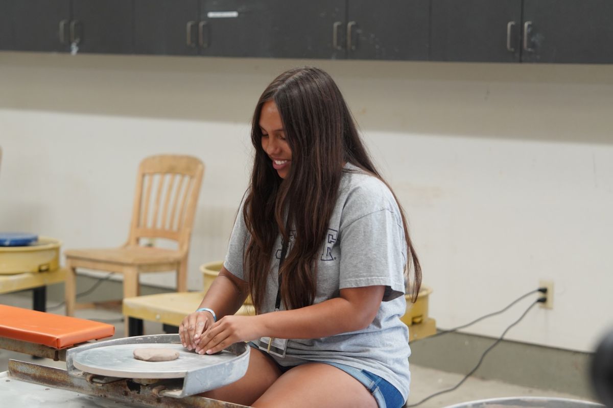 Ceramics students working with clay