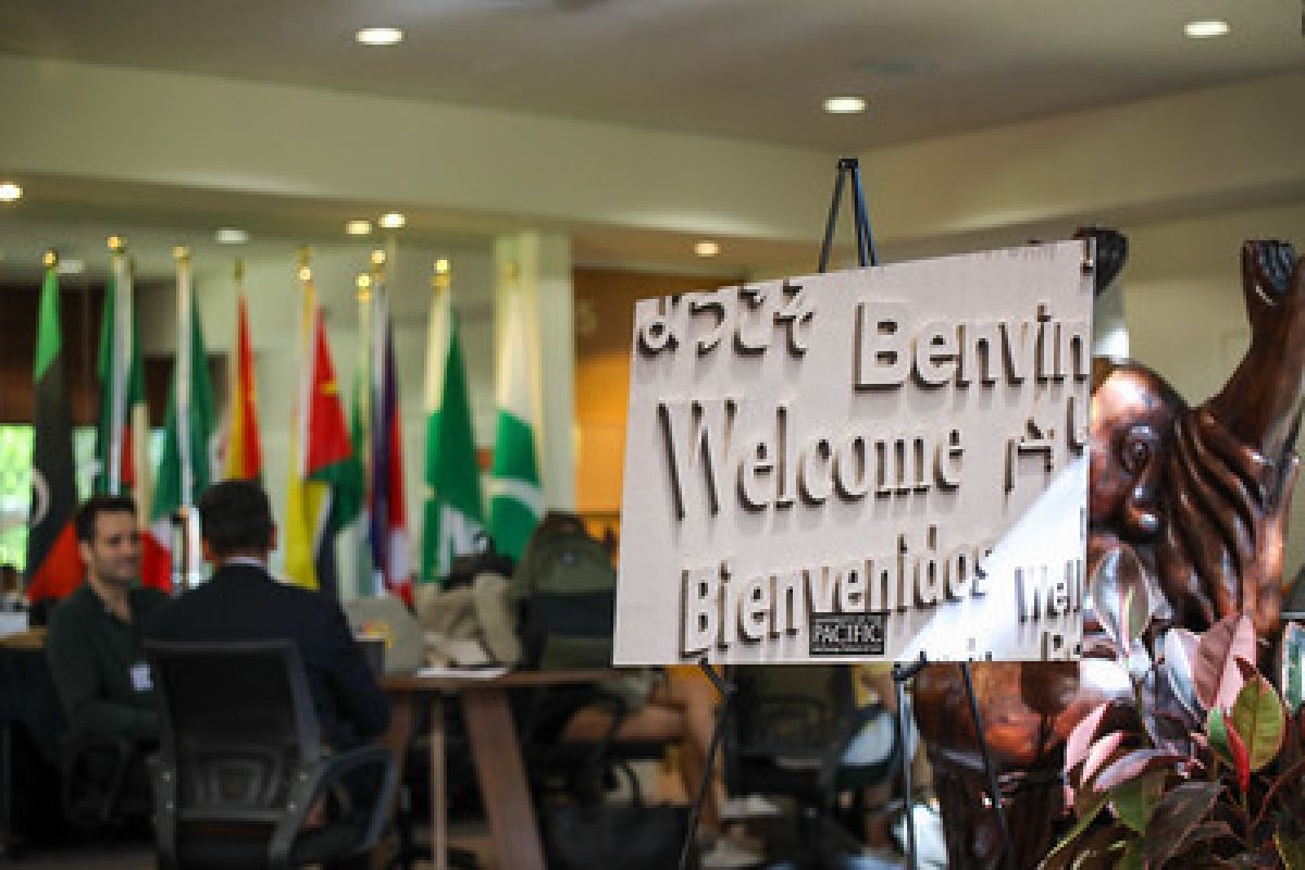 signage that says welcome in multiple languages